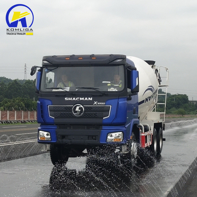 Shacman 6X4 Concrete Mixer Truck con prestazioni e sollevamento idraulico a ribaltatore ventrale