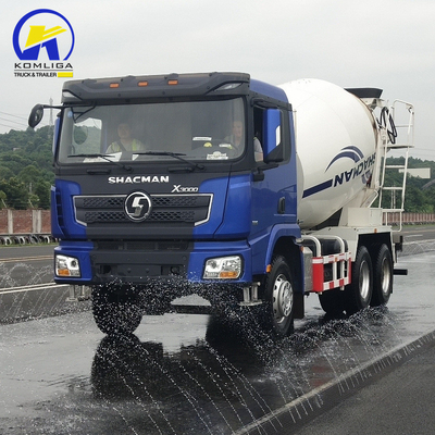 Shacman 6X4 Concrete Mixer Truck con prestazioni e sollevamento idraulico a ribaltatore ventrale