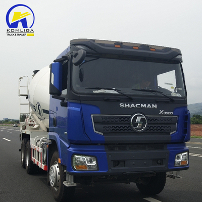 Shacman 6X4 Concrete Mixer Truck con prestazioni e sollevamento idraulico a ribaltatore ventrale