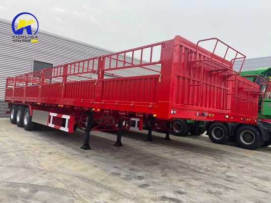 Semi-remorco a tre assi di colore rosso con recinzione a due velocità